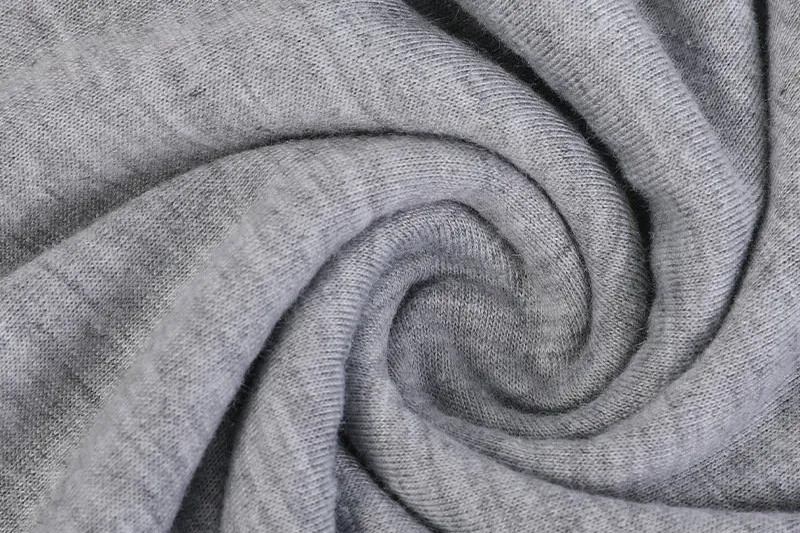 Fine grey jersey knit — the smooth inner layer used as jersey backing on bonded fabric