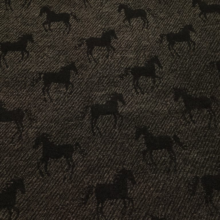 Pattern of black horses on fabric