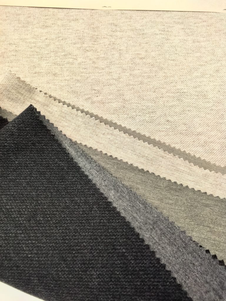 Fine-Gauge Tailored Diagonal Twill Mélange Fabric Various shades of textured fabric swatches