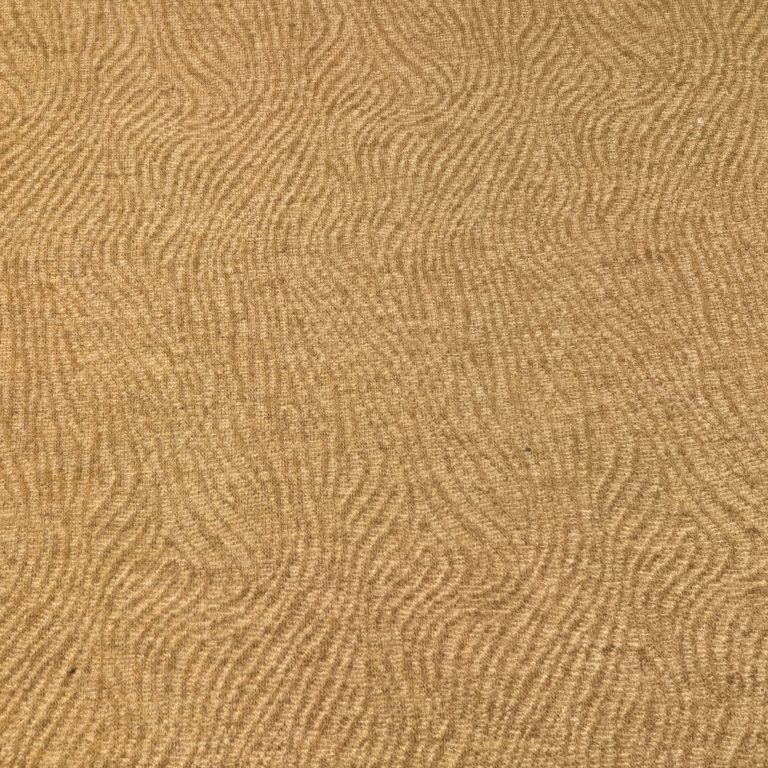Textured sandy surface with wave patterns
